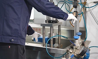 A filter housing positioned in a test fixture at a partner workshop
